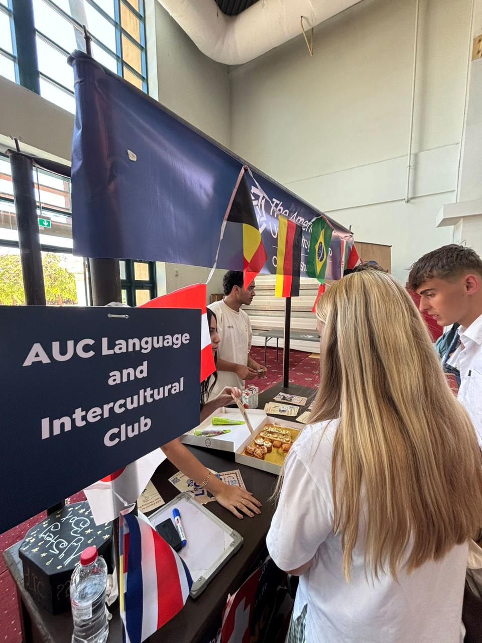 Visitors at the AUC Language and Intercultural Club booth